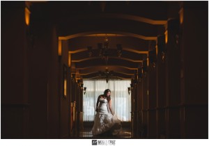 Moses Cruz wedding photographer bride poses in hallway windsor ballroom nj